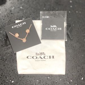 COACH Open Circle Necklace and Tea Rose Stud Set.